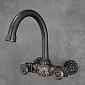 Classic bathroom wall faucet made of brass, black color, height 24 cm, spout length 19 cm