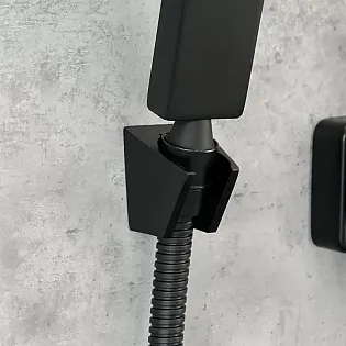 Modern-look wall-mounted bathtub faucet with a shower handset, height 15 cm, width 20 cm, color black, finish brushed